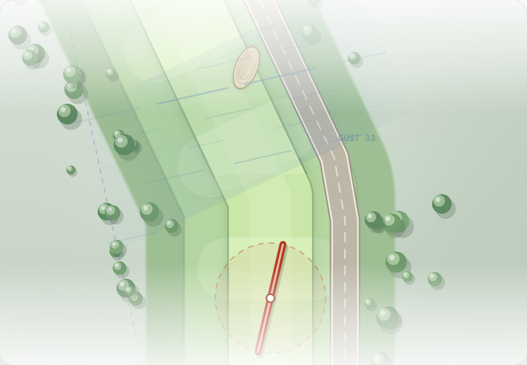 Plan view of a band of wind lines crossing a fairway, bending a ball's flight sideways.